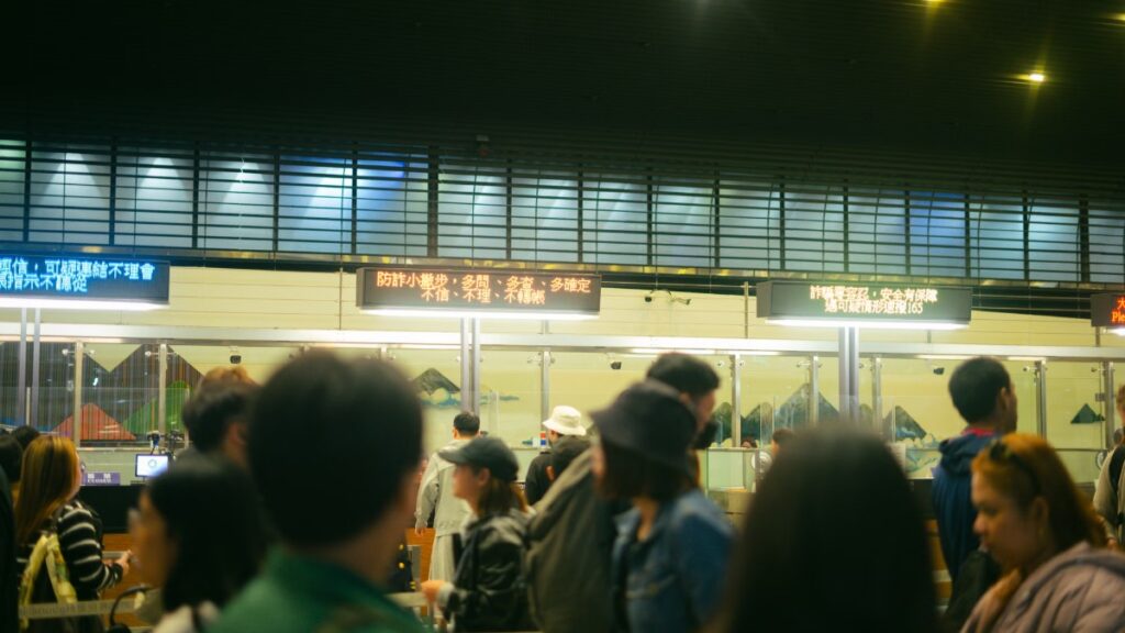 Crowded airport check-in line during peak travel