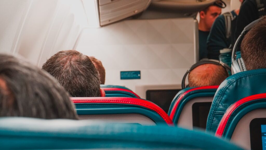 Full airplane cabin with passengers seated