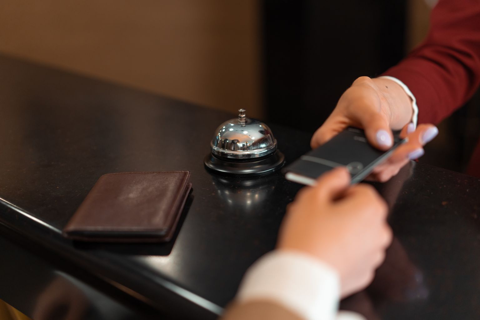 Guest paying at hotel check-in after booking on Hotels.com or Booking.com